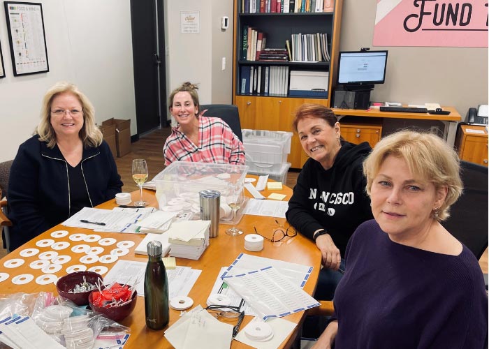 Four women sitting at table