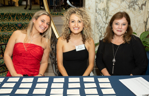 Three women sitting at table
