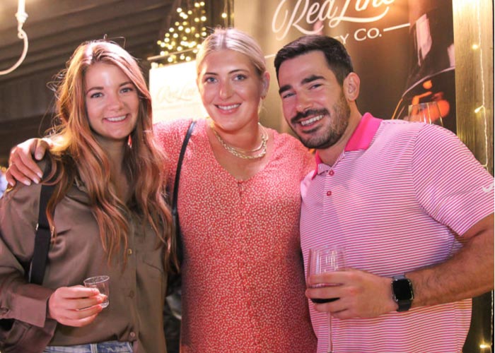 Three people smiling at camera