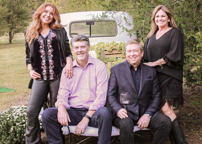 Two couples at pickup truck tailgate